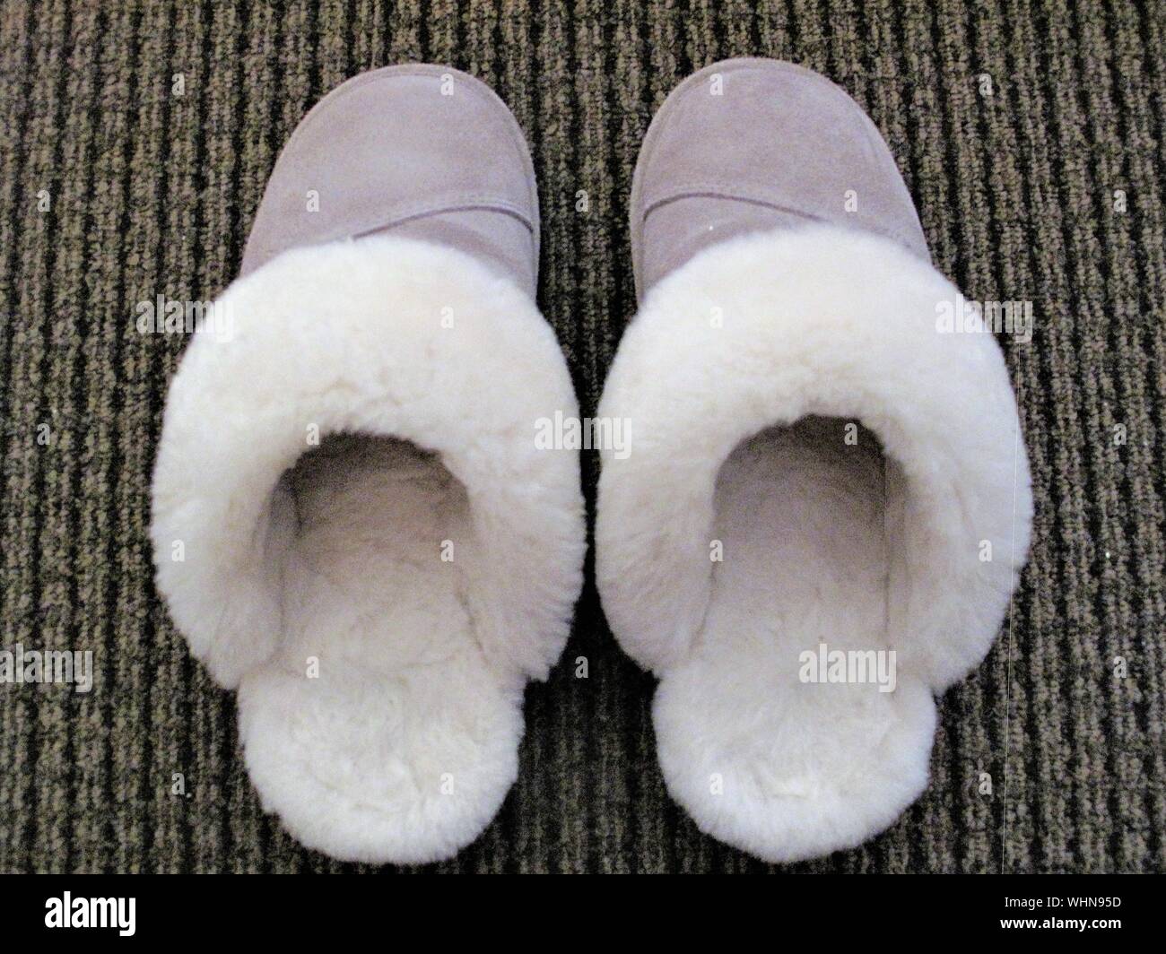 Brown sheepskin slippers hi-res stock photography and images - Alamy
