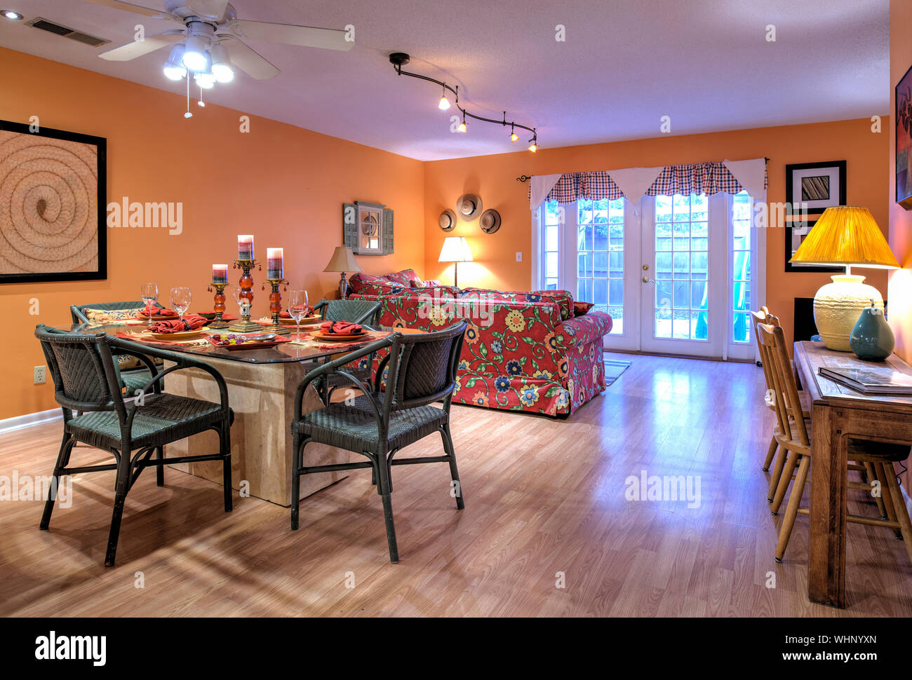 Image showcasing Stylish open concept apartment interior with orange walls and decor ...