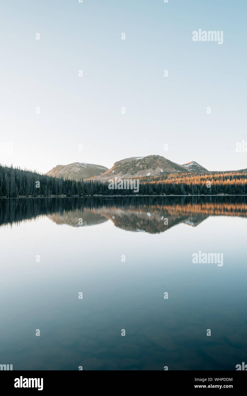 Mountains reflecting in Mirror Lake, in the Uinta Mountains, Utah Stock
