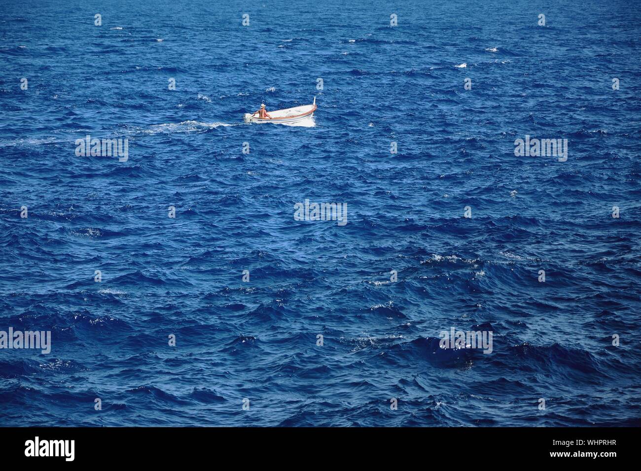 Boat In Open Sea Stock Photo