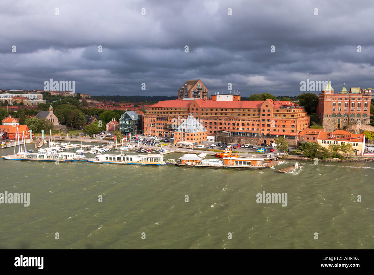 Gothenburg a beautiful city in Sweden, a view from the river Gota Alv on the shore line with boats and nice buildings Stock Photo