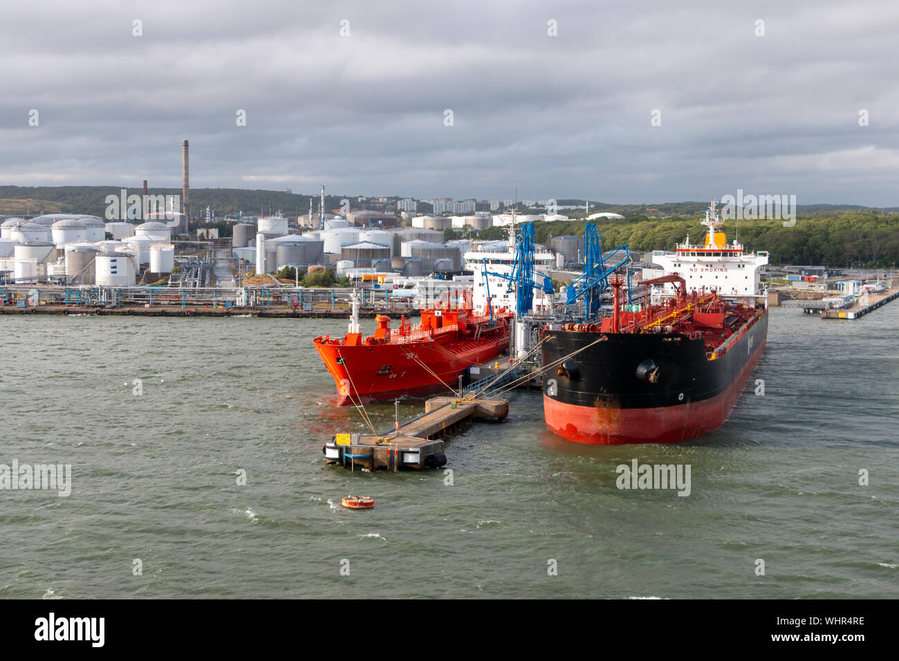 Tank farm in Gothenburg Sweden, cargo ships are in dock to load or unload their freight Stock Photo