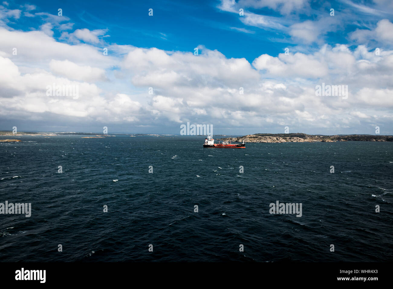 View at the coastline of Gothenburg in Sweden a baltic sea with heavy clouds and big rocks coming out of the sea Stock Photo