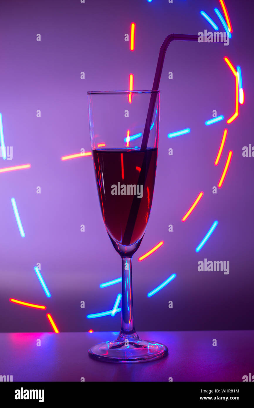 glass of cocktail with background. A glass on the bar in a cafe ...