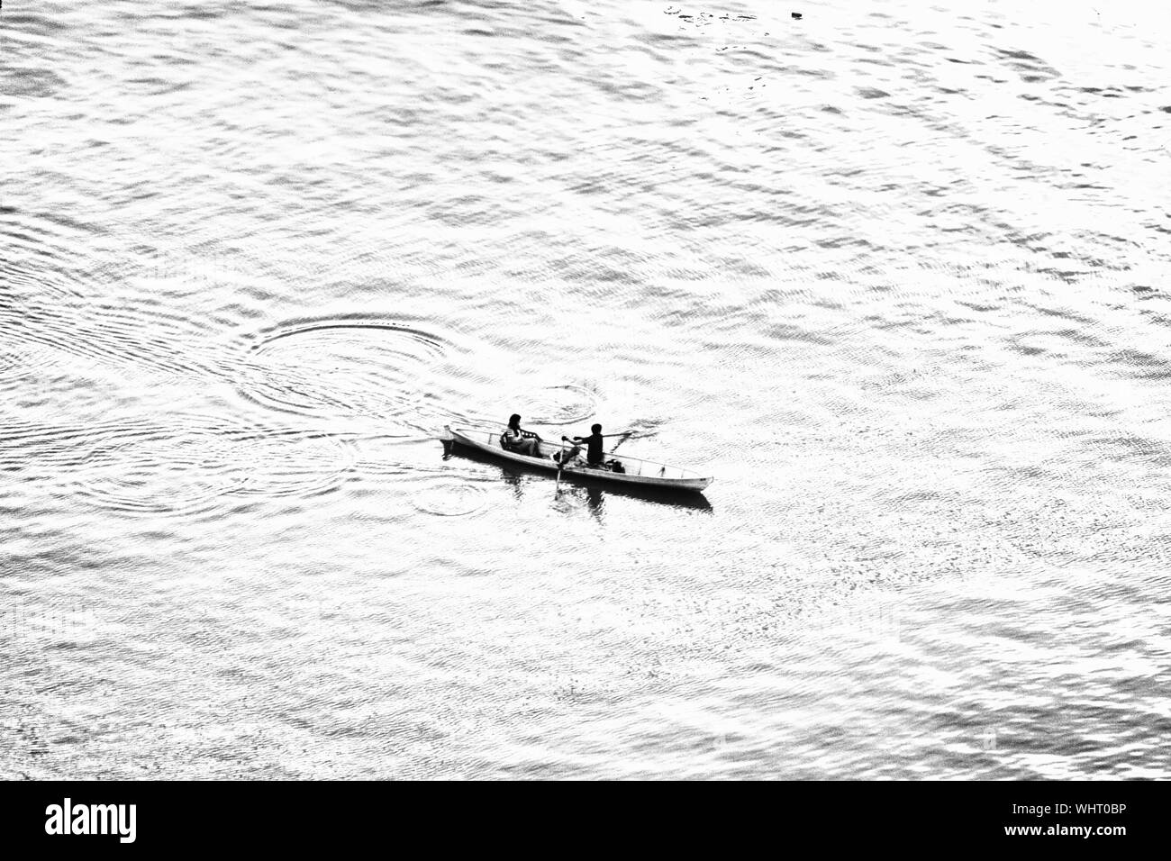 Men in rowing boat Black and White Stock Photos & Images - Alamy