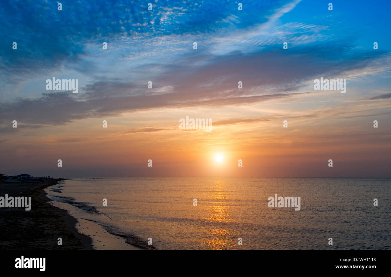 sunrise over the sea and beautiful cloudscape Stock Photo - Alamy
