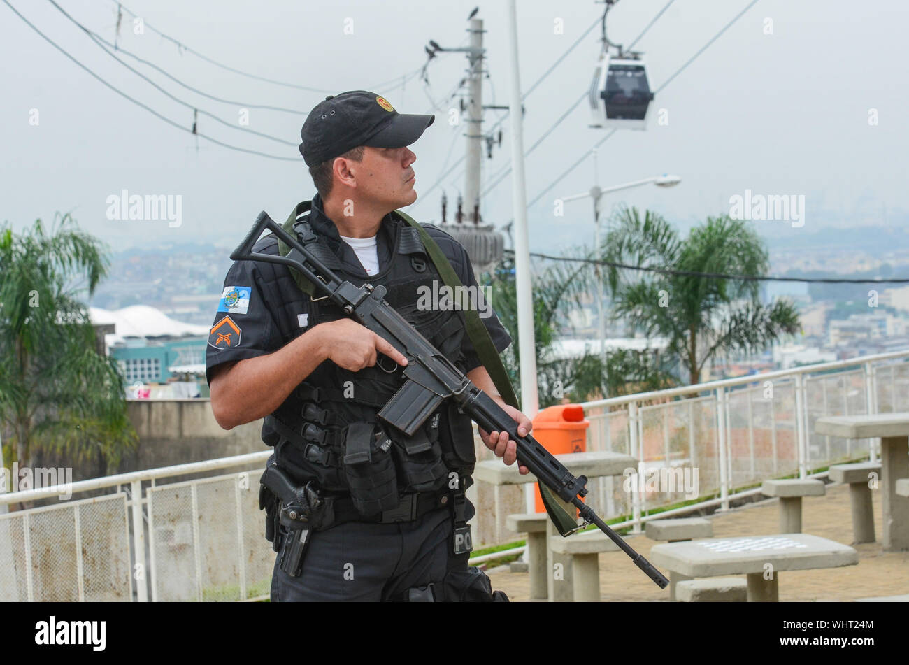 RIO DE JANEIRO, BRAZIL, MARCH, 21, 2015: Rio de Janeiro military police with snipers patrolling the German complex, slum complex Stock Photo