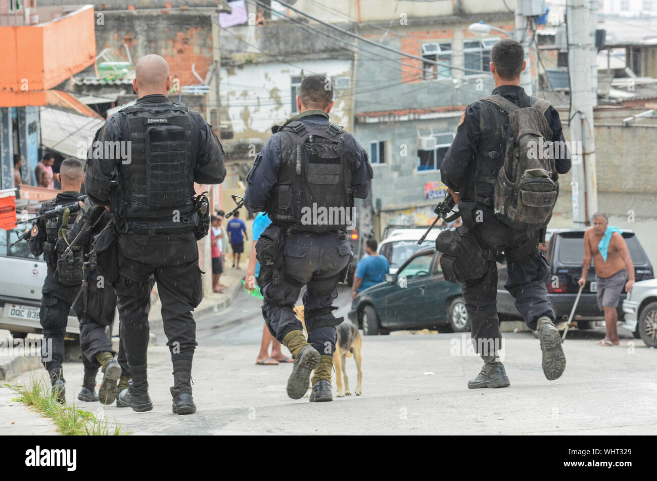RIO DE JANEIRO, BRAZIL, MARCH, 21, 2015: Rio de Janeiro military police with snipers patrolling the German complex, slum complex Stock Photo