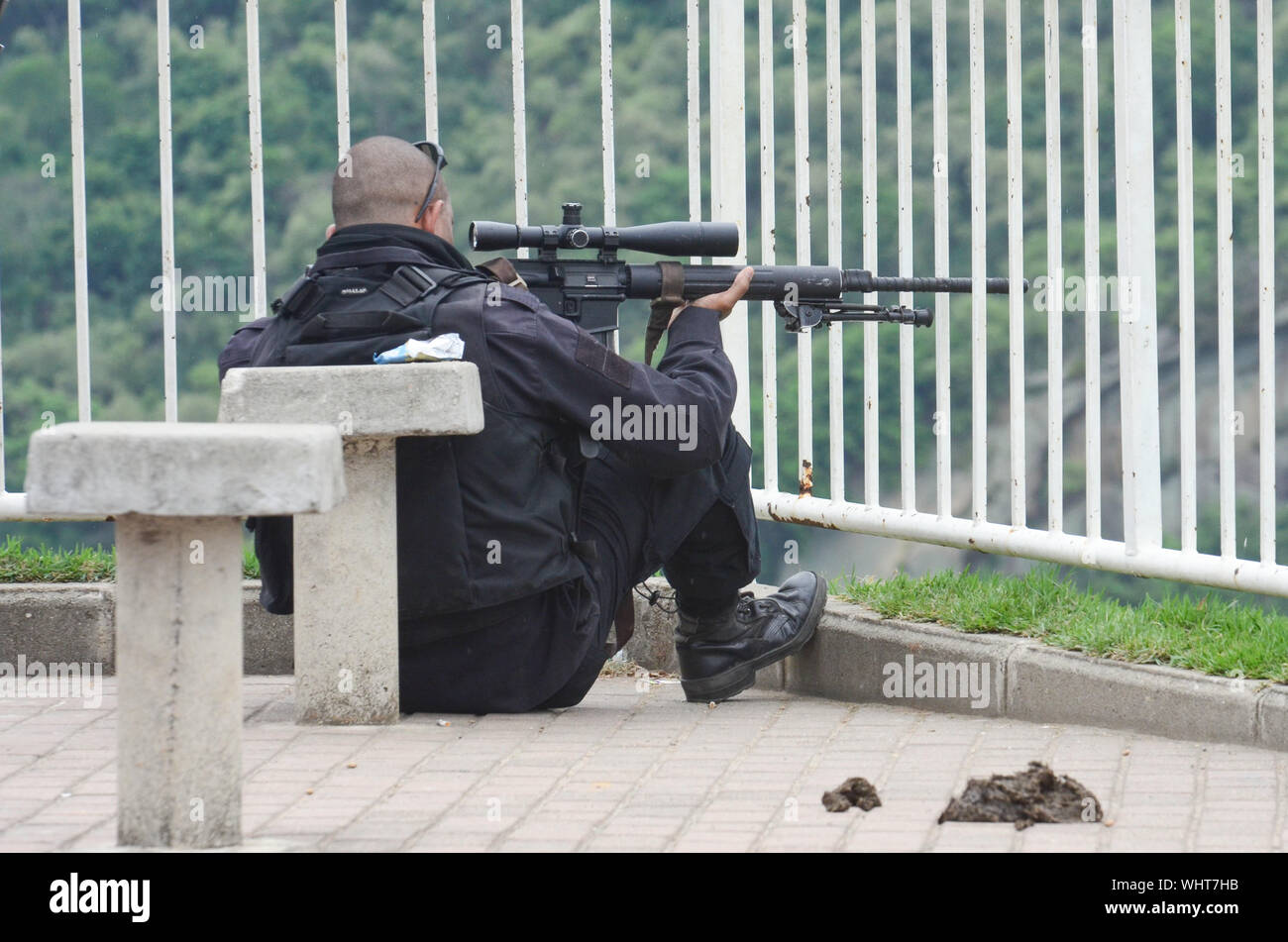 RIO DE JANEIRO, BRAZIL, MARCH, 21, 2015: Rio de Janeiro military police with snipers patrolling the German complex, slum complex Stock Photo