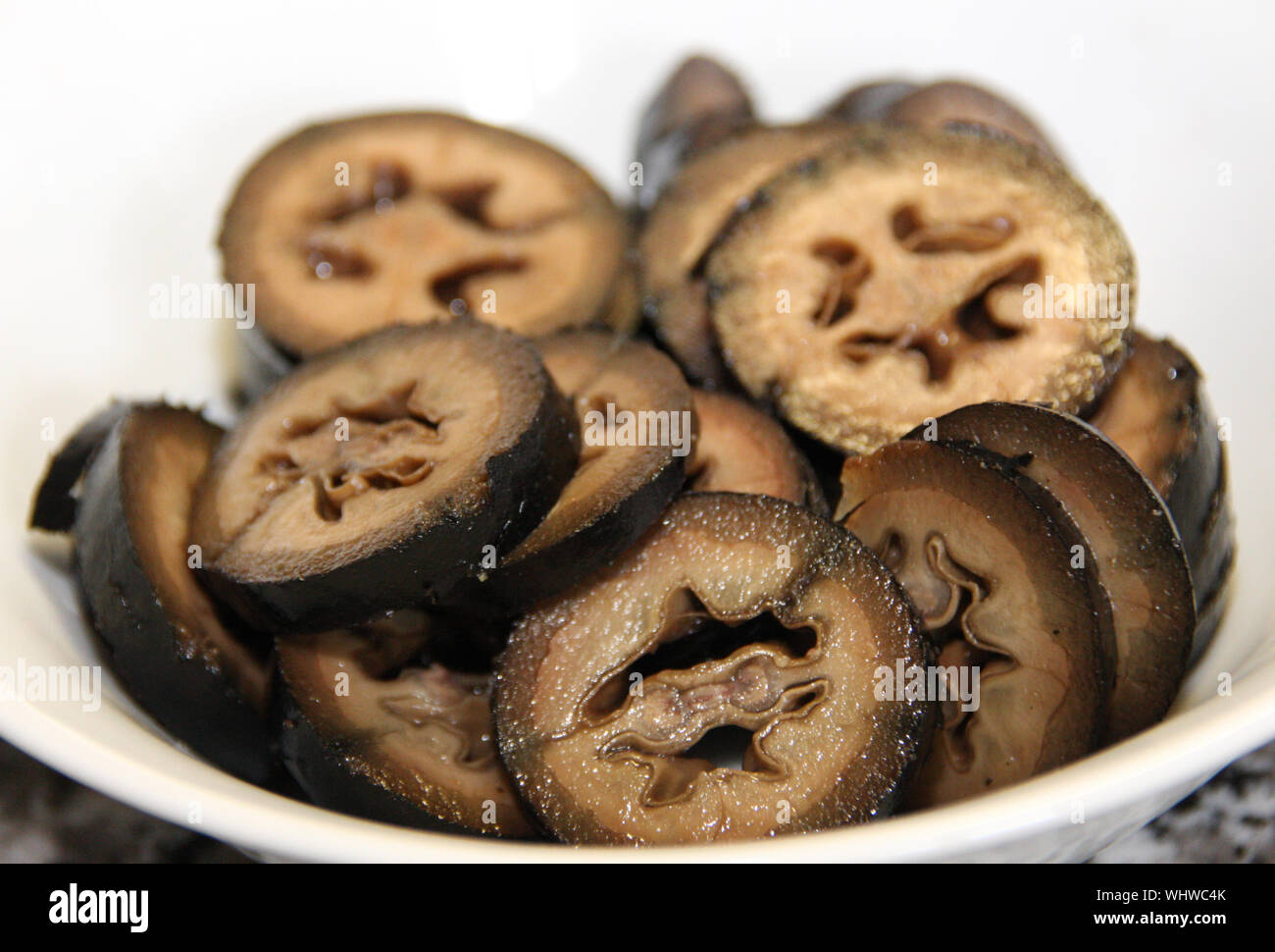 Slices of black candied walnuts a specialty Schwarze Nüsse eine besondere Spezialität Stock Photo