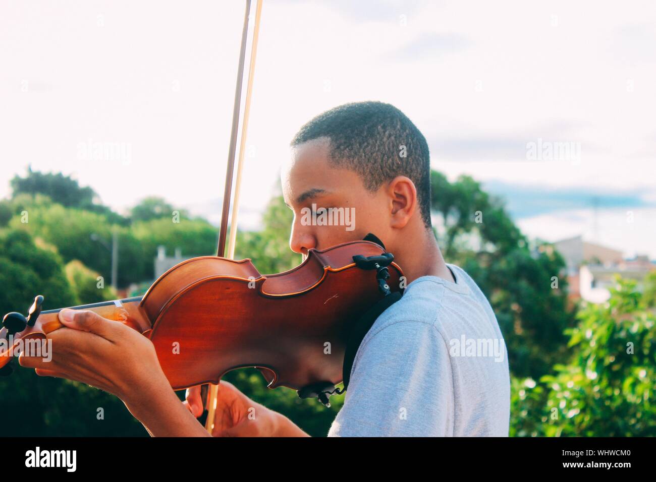 Teenage Boy Playing Violin Stock Photo