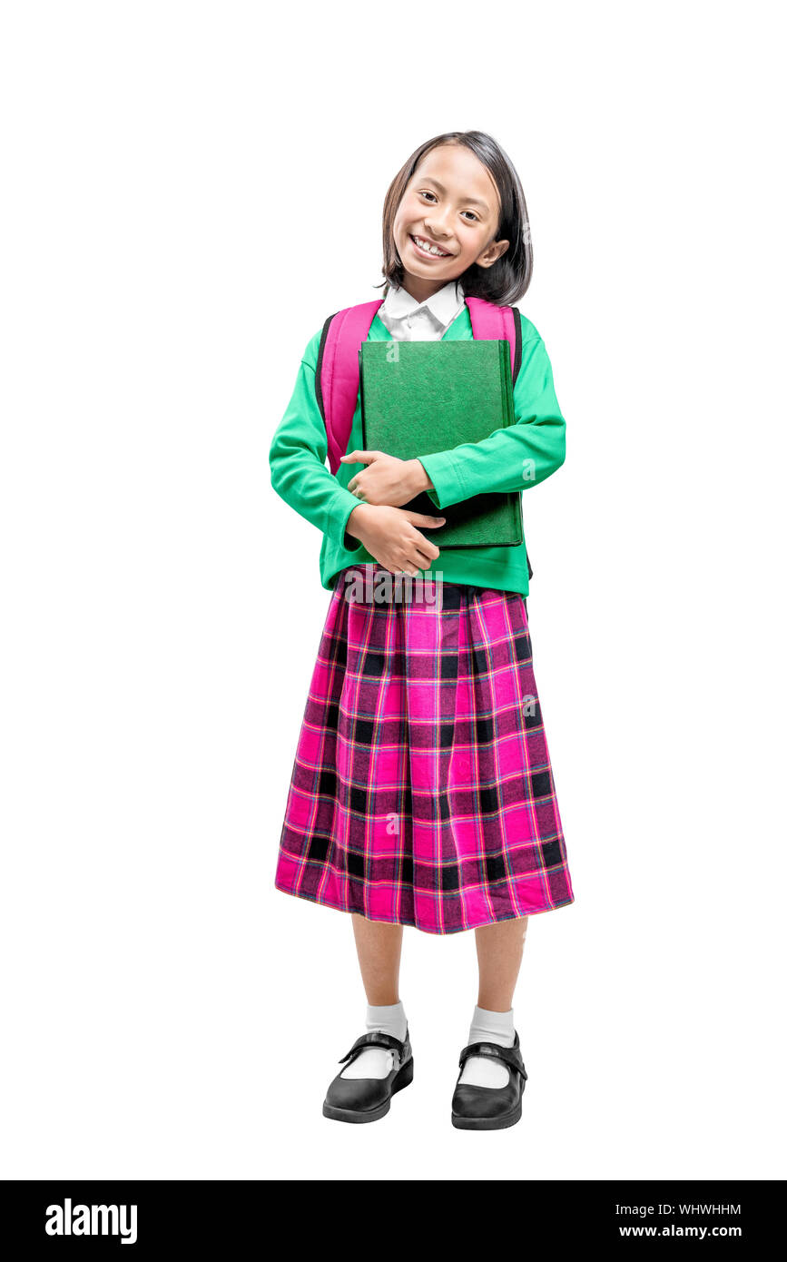 Asian cute girl with a backpack holding the book standing isolated over white background Stock Photo