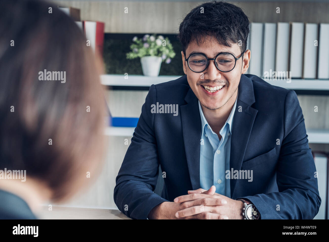 businessman interview with interviewer candidate see qualification  data that apply for job at meeting room in modern office Stock Photo