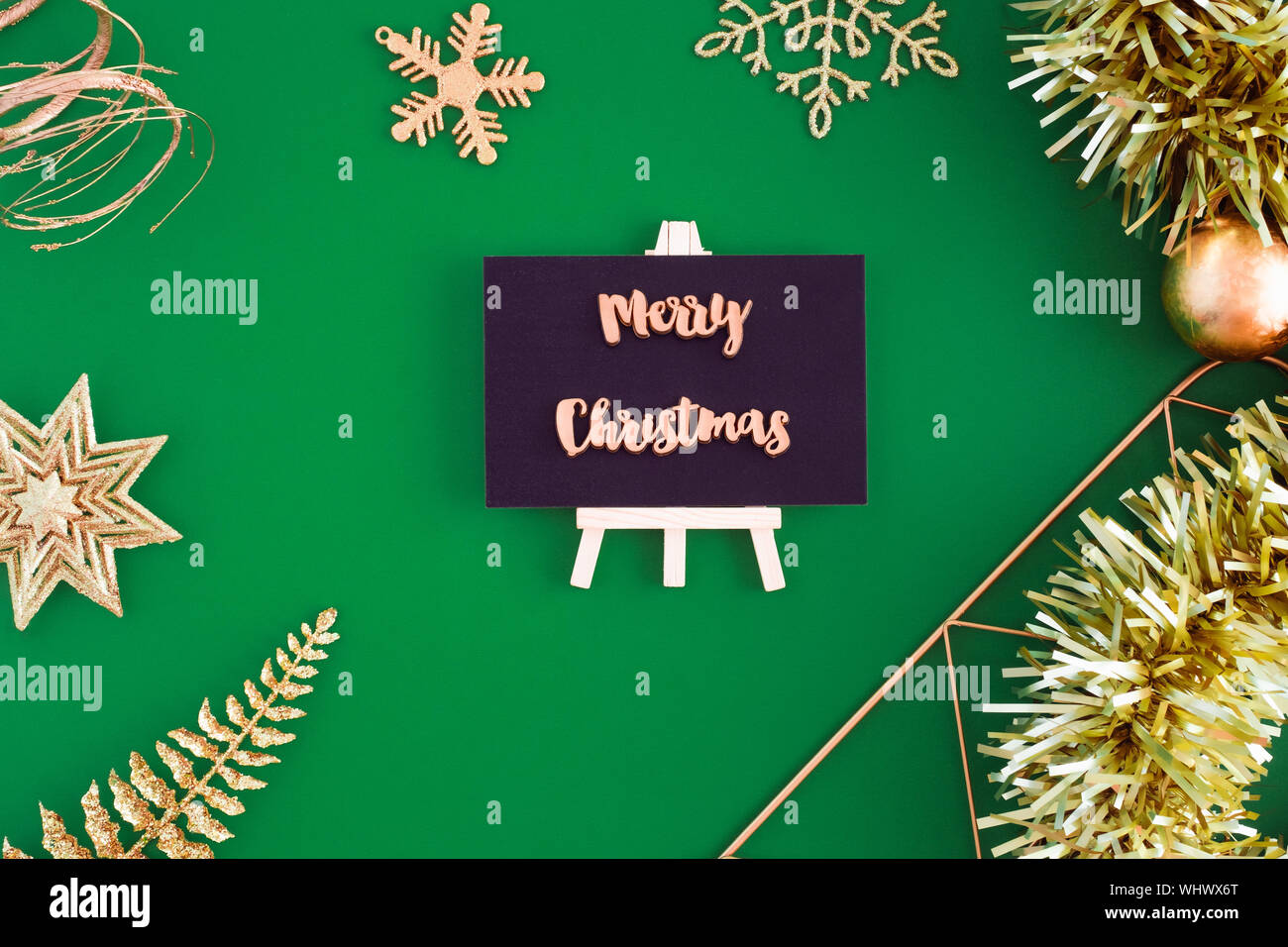 Merry Christmas On Blackboard Top View With Gold Christmas And New
