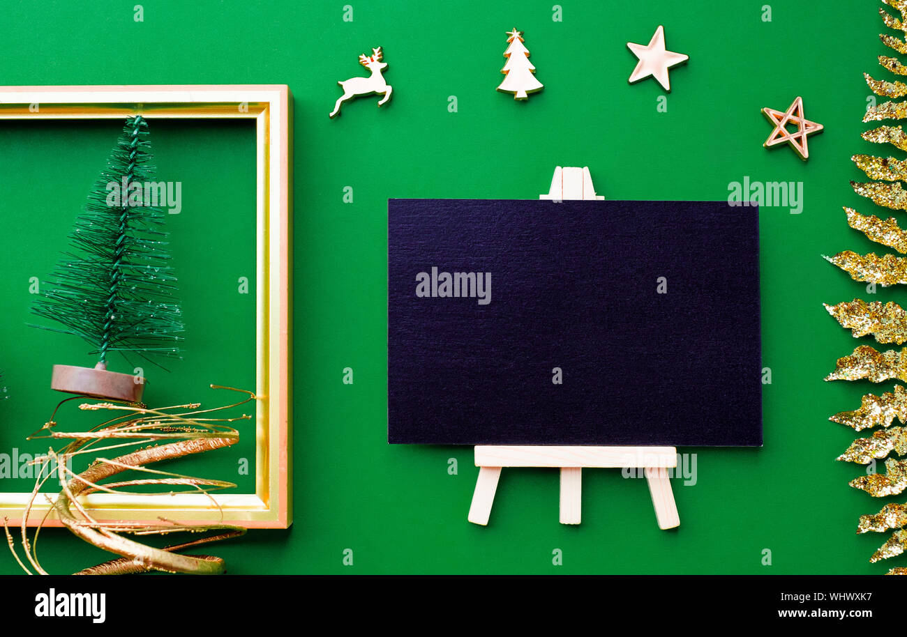 Blackboard Top View With Gold Christmas And New Year Decoration