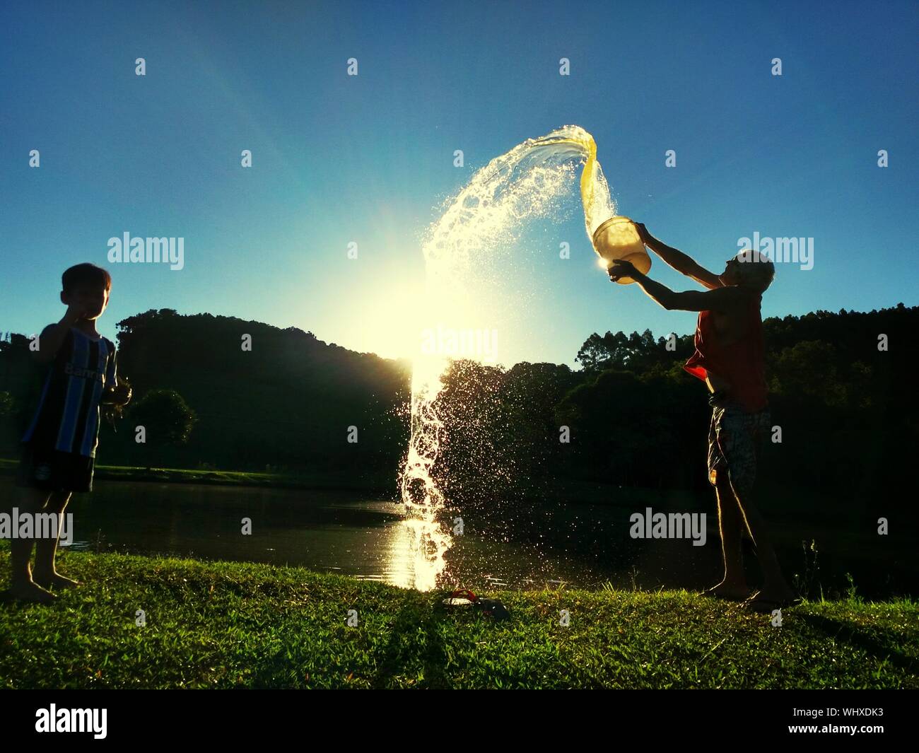 Throwing Bucket Water High Resolution Stock Photography and Images Alamy