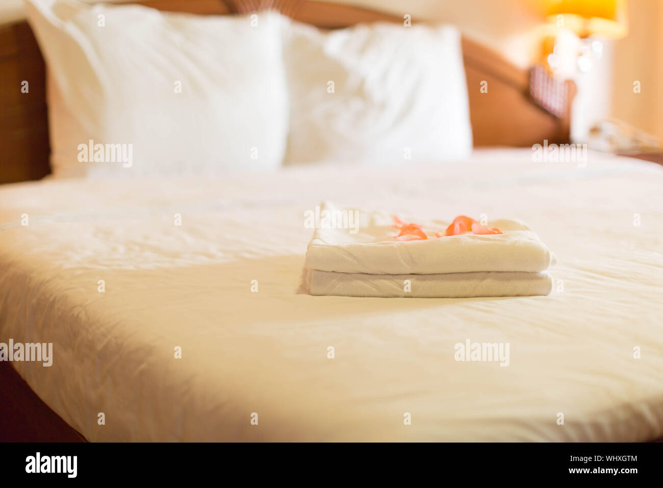 A made bed ready to guests in a resort Stock Photo Alamy