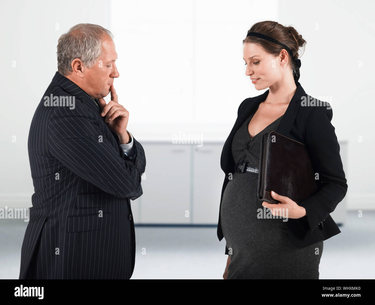 Boss and Pregnant Businesswoman Stock Photo - Alamy