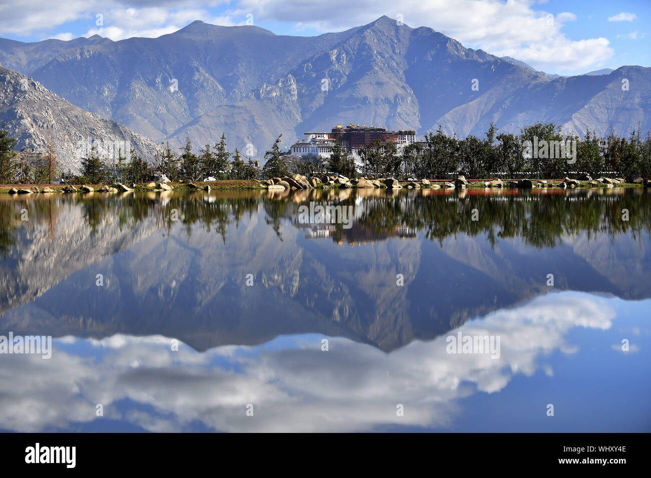 (190903) -- BEIJING, Sept. 3, 2019 (Xinhua) -- Photo taken on June 5, 2019 shows scenery of the Potala Palace in Lhasa, capital of southwest China's Tibet Autonomous Region. China has adopted the vision that lucid waters and lush mountains are invaluable assets and pursued a holistic approach to conserving its mountains, rivers, forests, farmlands, lakes, and grasslands. At the very highest levels, China is driving the way forward in the construction of an ecological civilization. (Xinhua/Chogo) Stock Photo