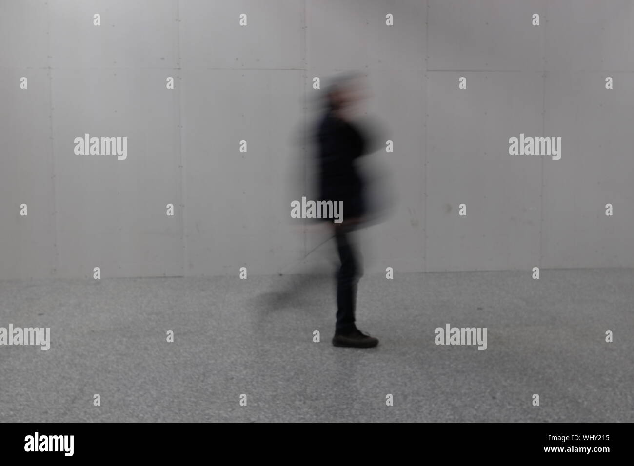Person blurred walking by wall hi-res stock photography and images - Alamy