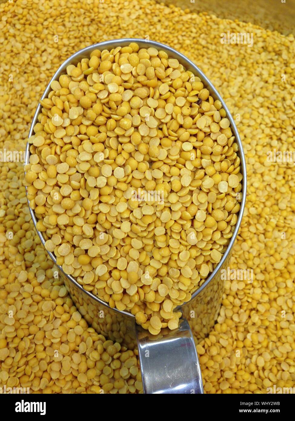 Yellow Split Peas In Container For Sale Stock Photo