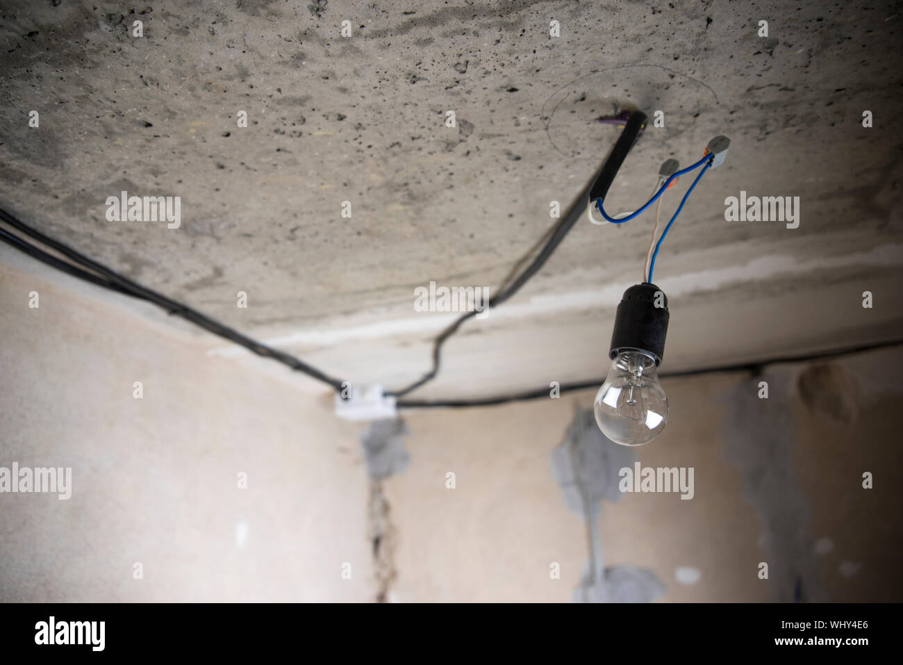 Replacing The Electric Lamp On The Ceiling During Repair Stock