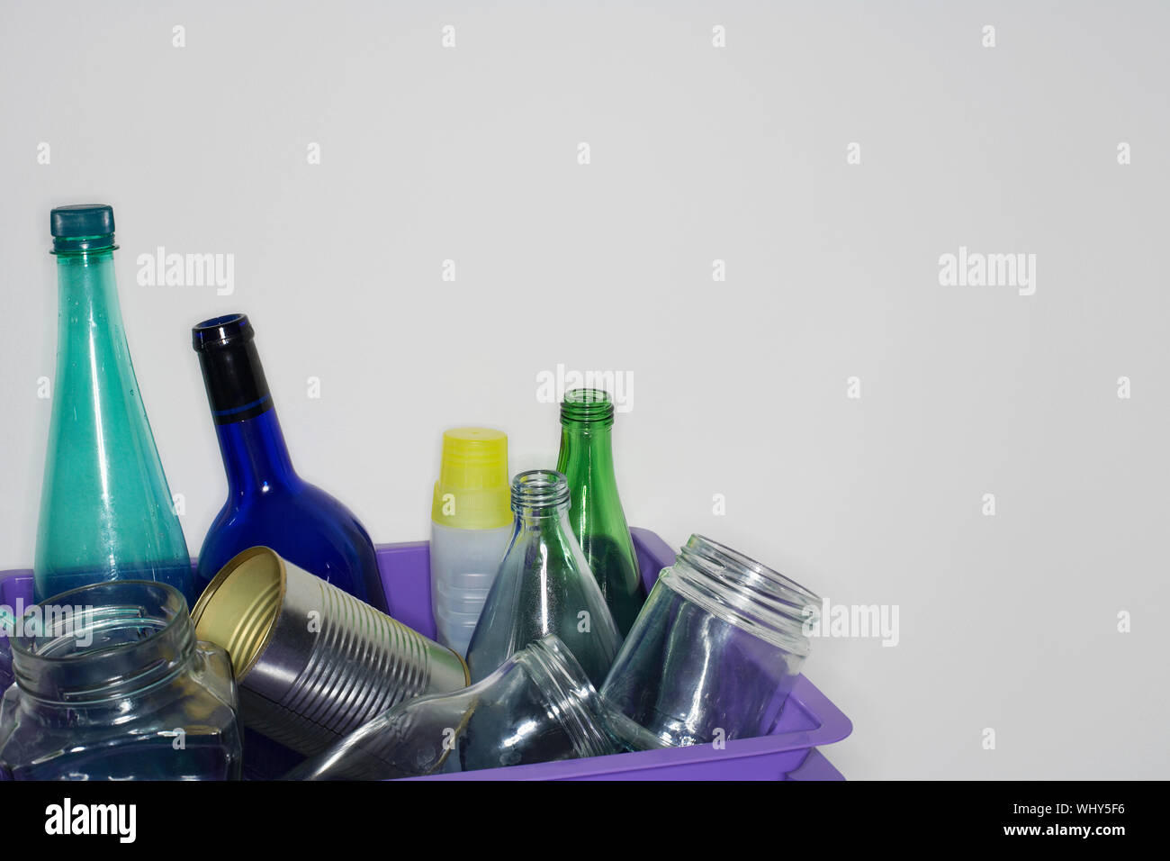 Closeup of cropped recycling container filled with empty jars and ...