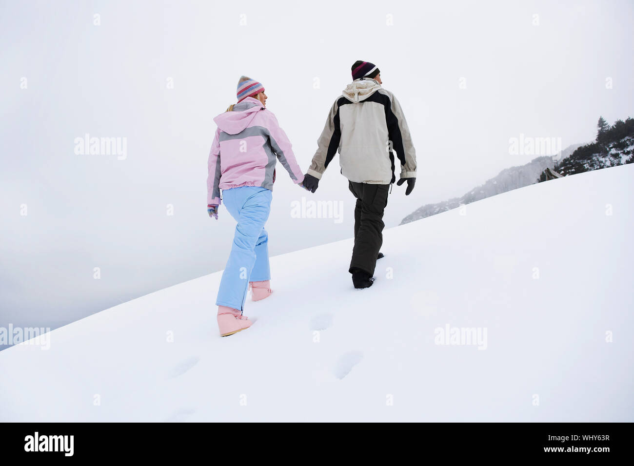 Romantic couple snow rear view hi-res stock photography and images - Alamy