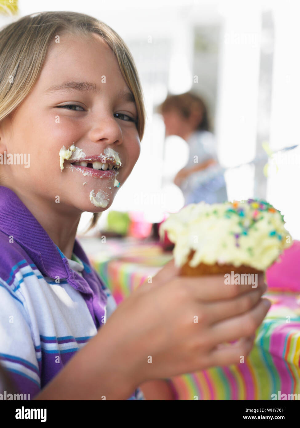 Messy child eating cupcake hi-res stock photography and images - Alamy