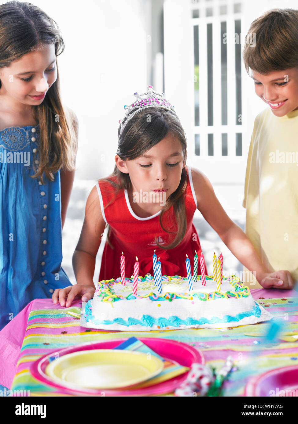 Girl blowing out birthday candles at the outdoor party Stock Photo - Alamy