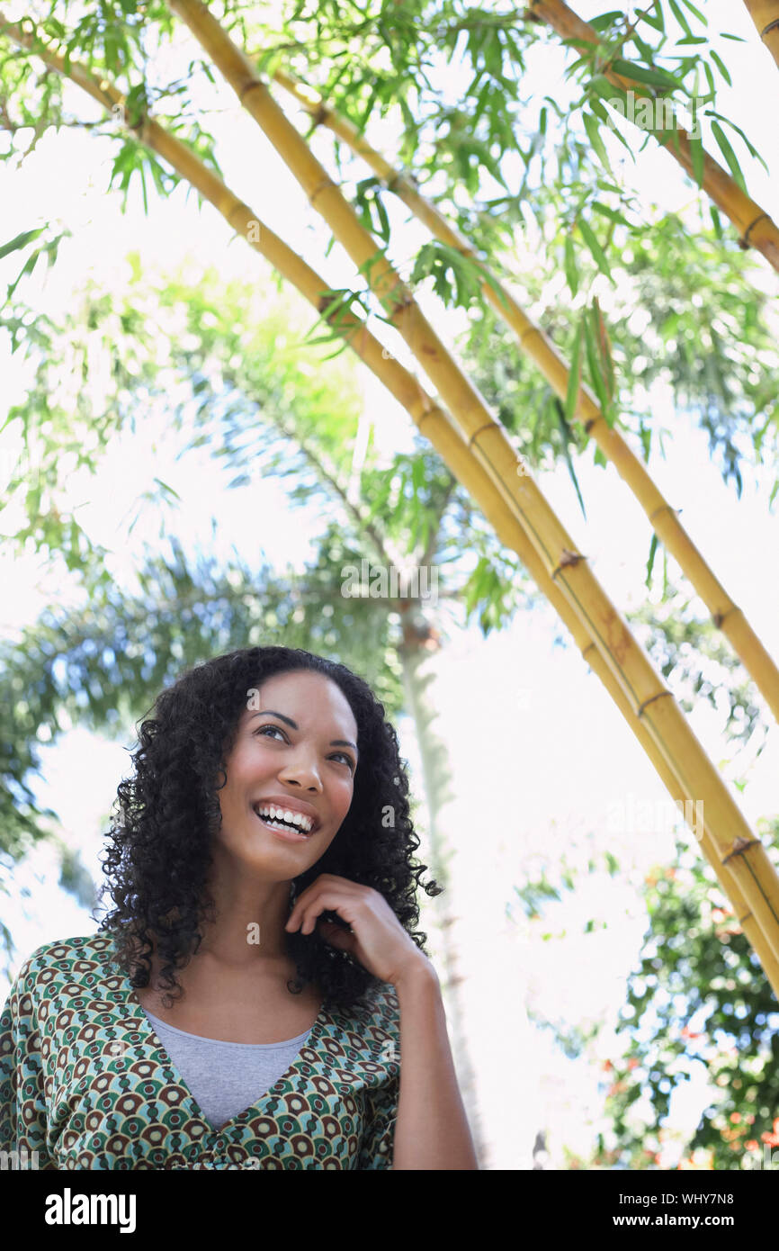 Cheerful young African American woman in bamboo forest Stock Photo - Alamy