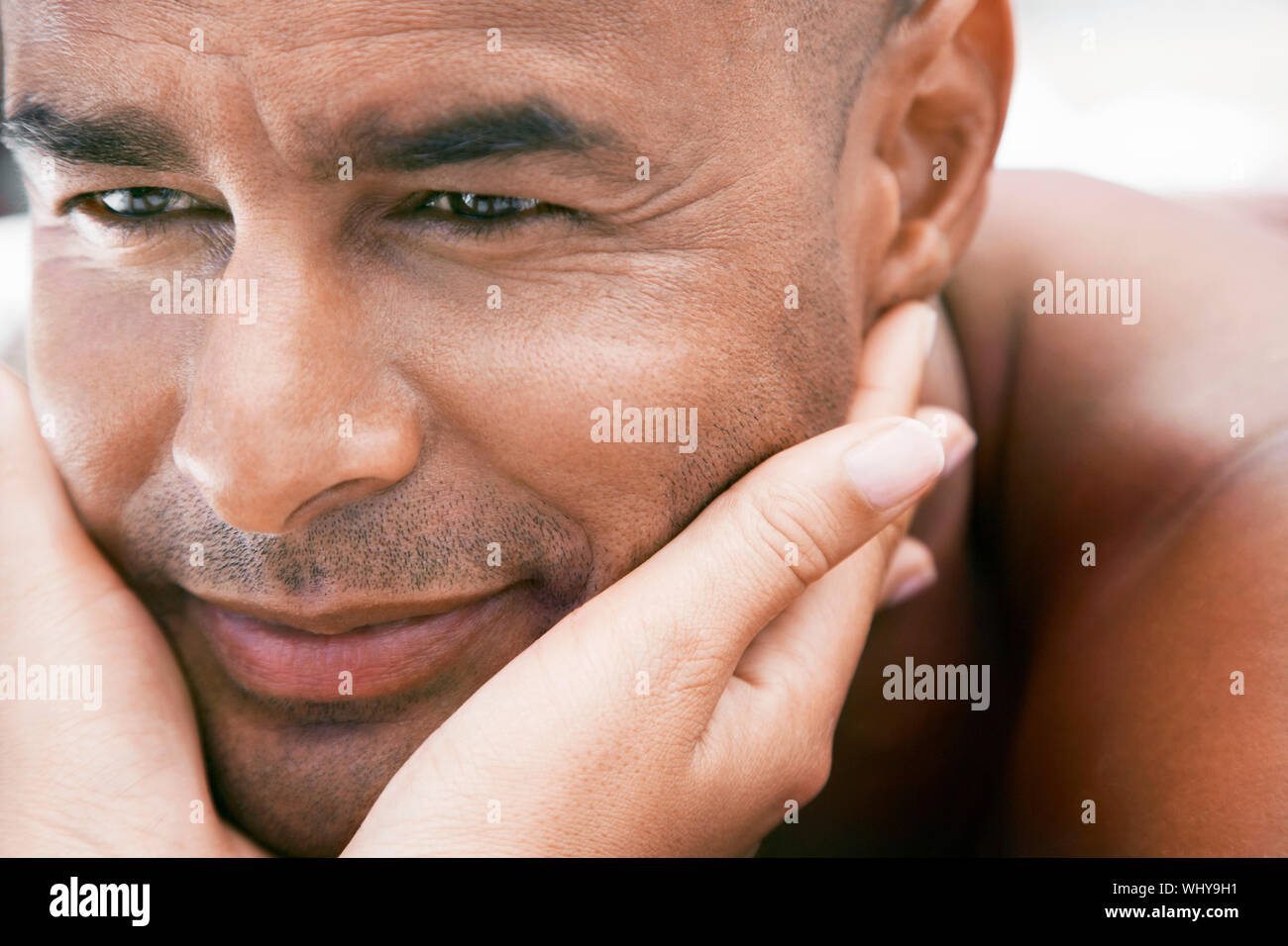 Closeup of woman’s hands cupping man Stock Photo - Alamy