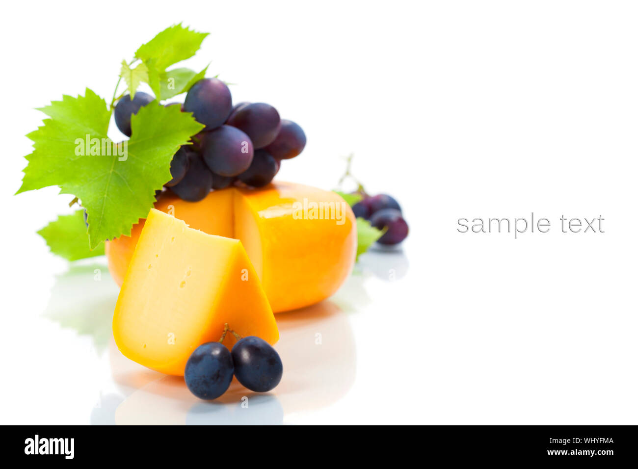 grapes and cheese over white Stock Photo Alamy