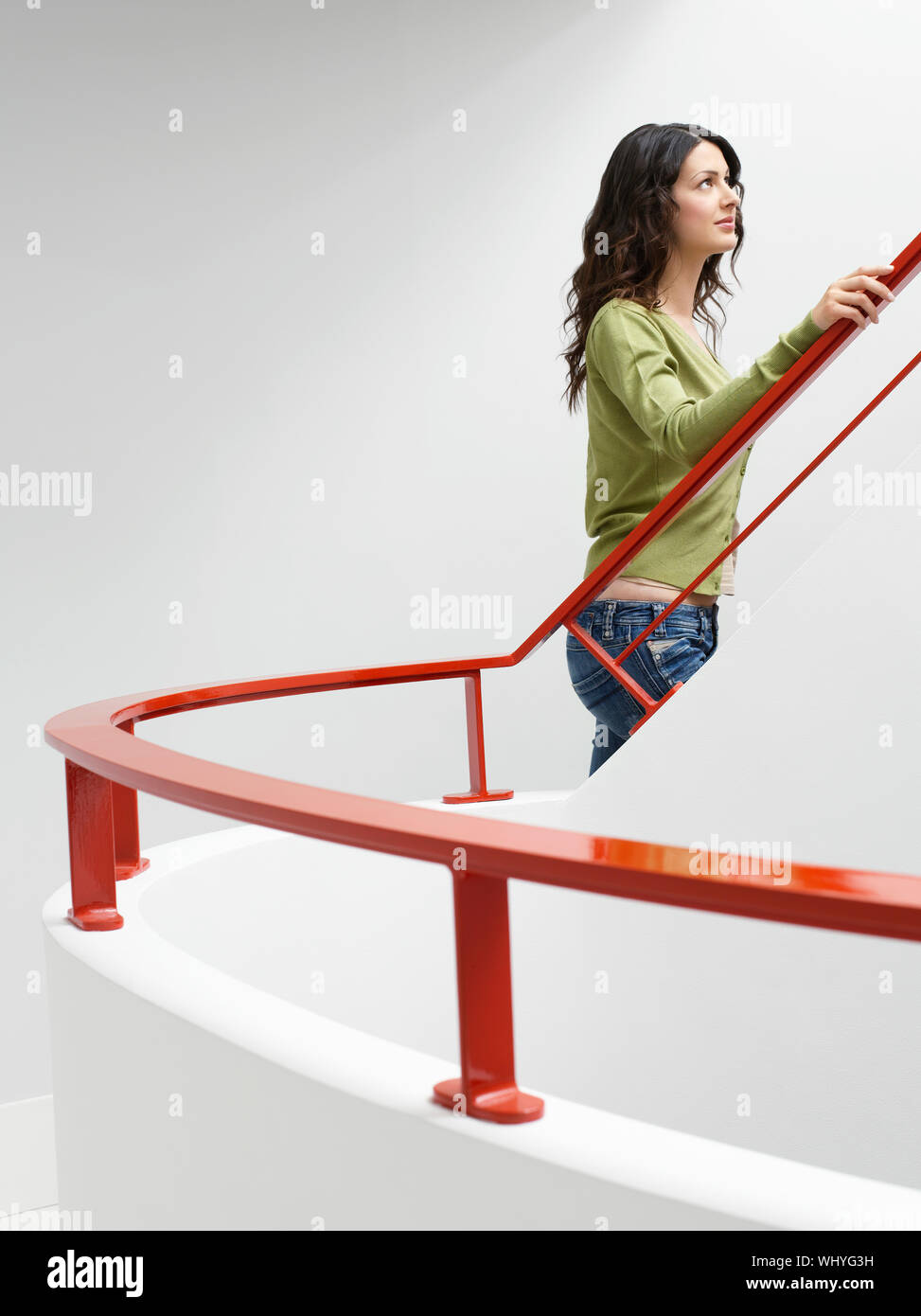 Woman climbing stairs indoors hires stock photography and images Alamy