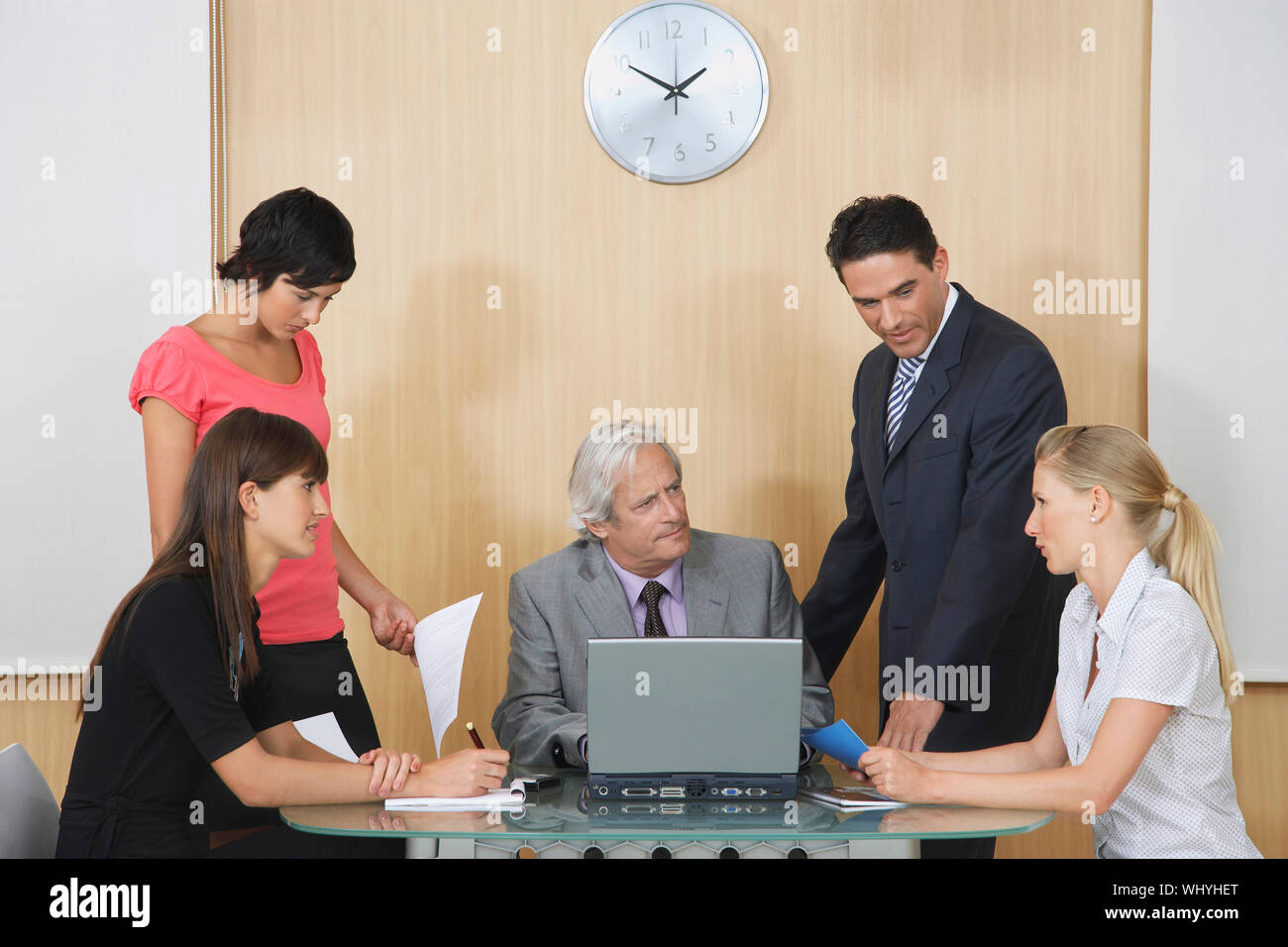 Businesspeople having meeting with laptop in conference room Stock Photo