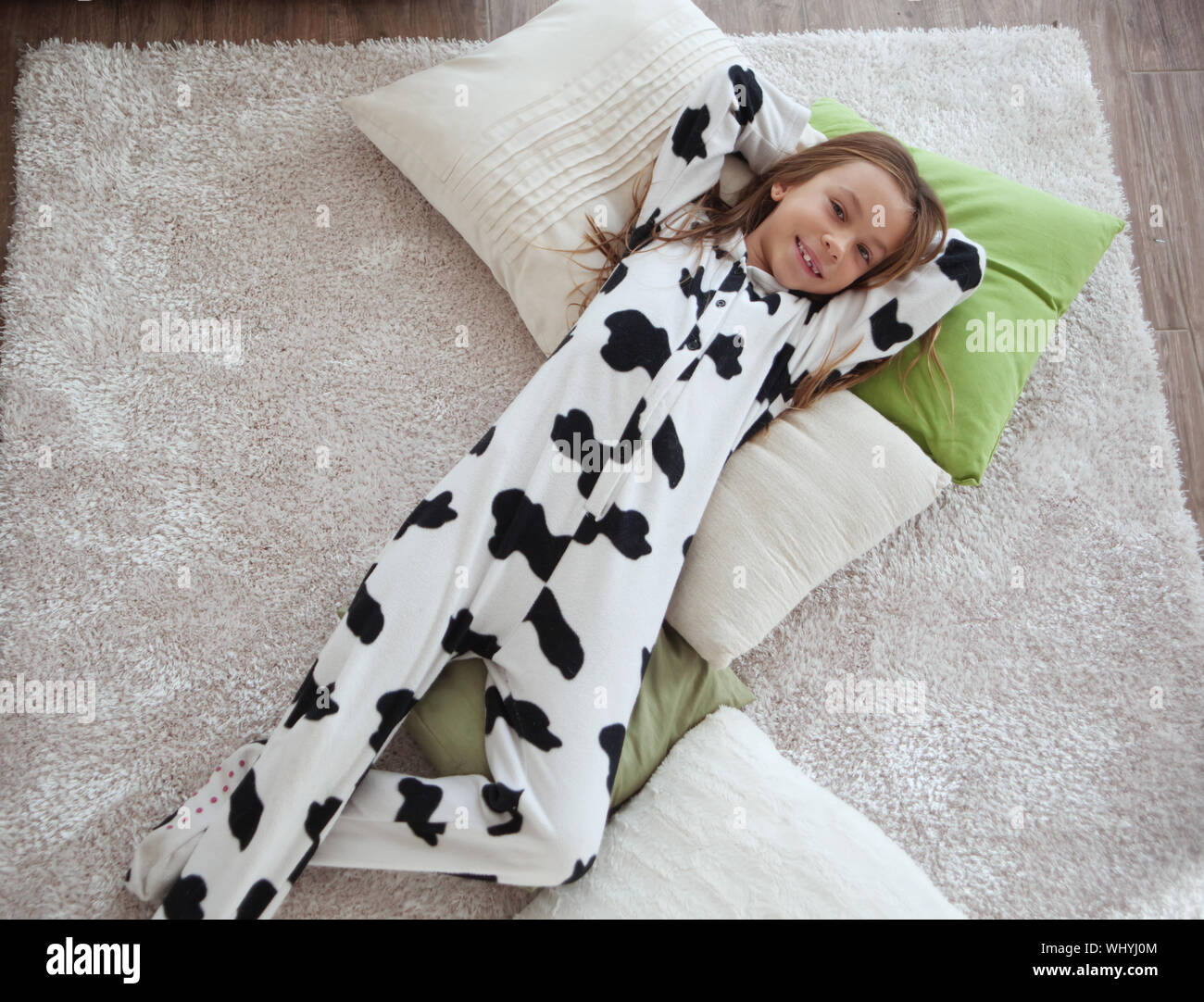 Portrait of child in soft warm cow print pajamas waking up at morning Stock  Photo - Alamy