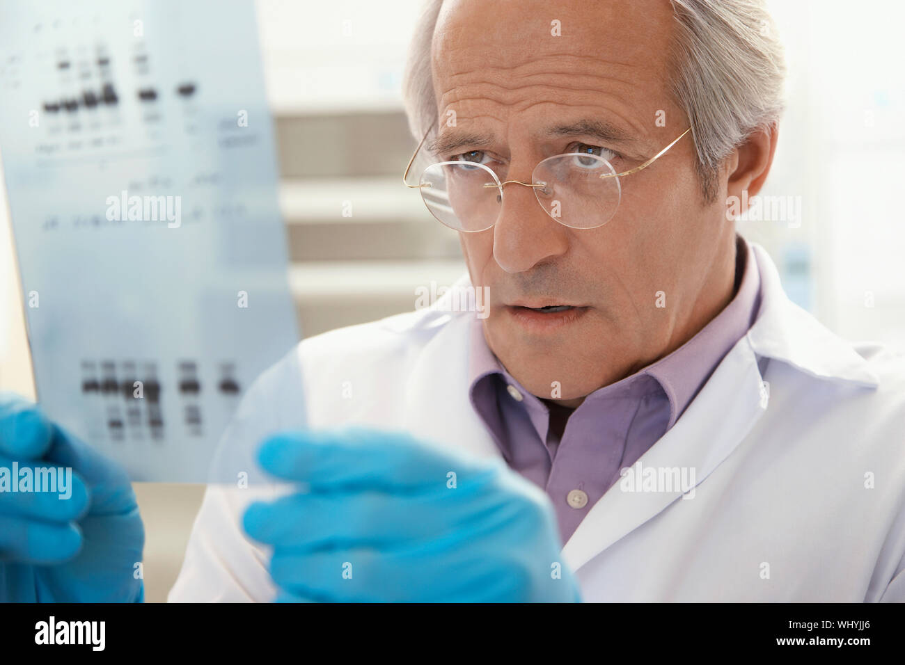 Scientist looking dna test results hi-res stock photography and images ...