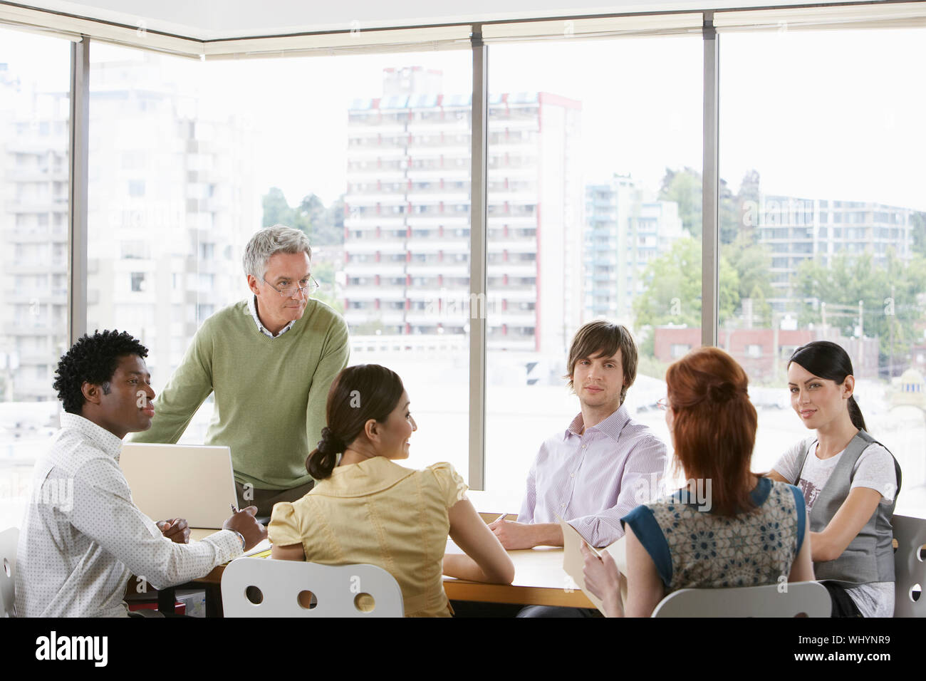 Group of multiethnic business colleagues at office meeting Stock Photo ...