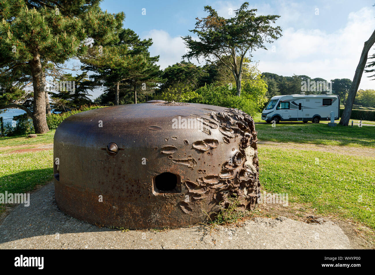Motorhome camped beside the German gun emplacements, which show the scars from invading allied forces, at Camping de la Cité d'Aleth, St Malo Stock Photo