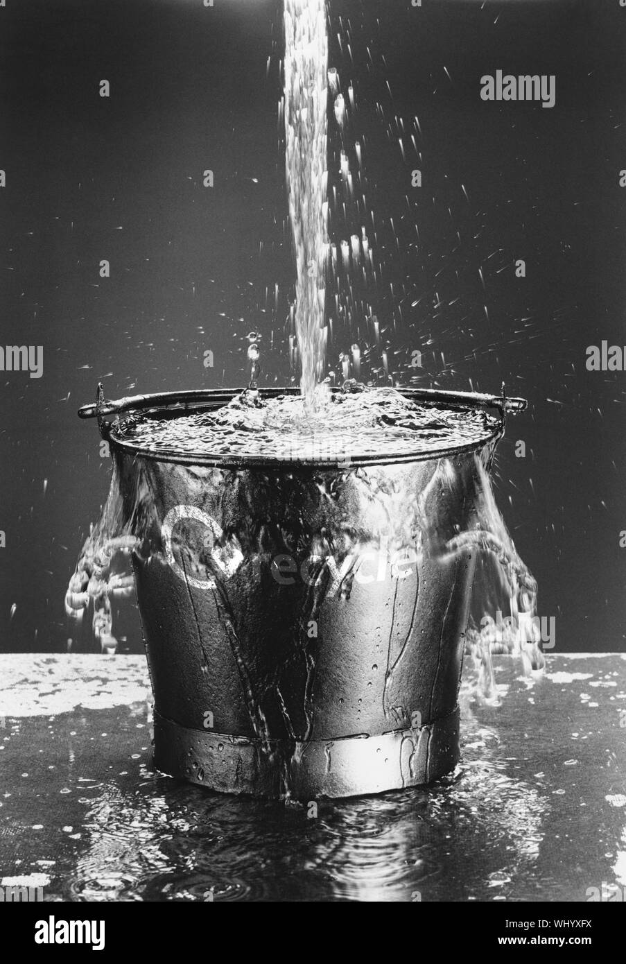 Water Pouring in Bucket Stock Photo Alamy
