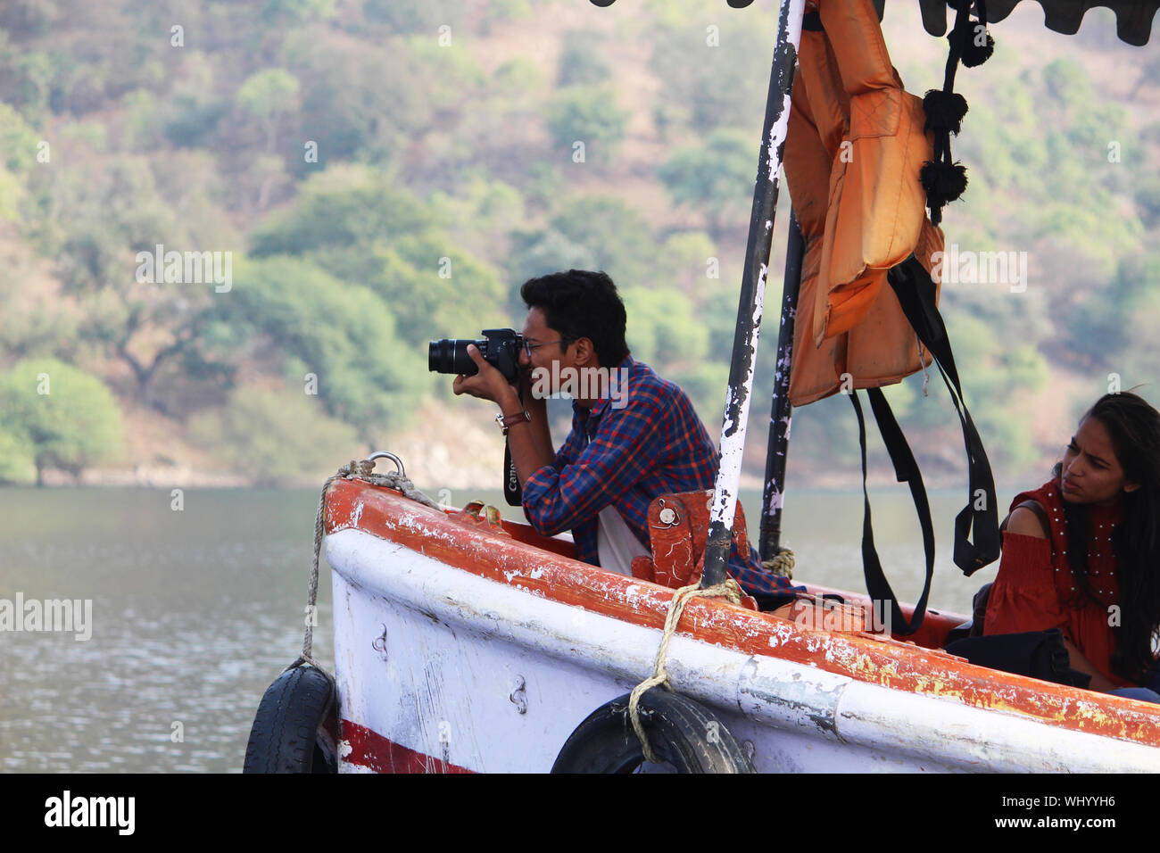 Indian man sitting on boat hi-res stock photography and images - Alamy