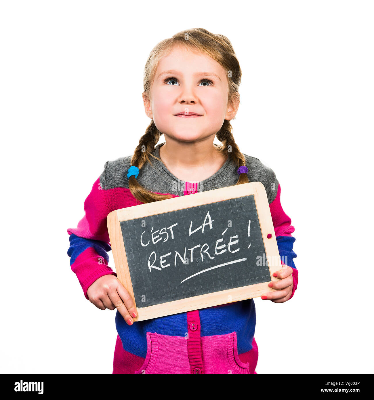 happy school girl with a traditionnal slate in his hands Stock Photo ...
