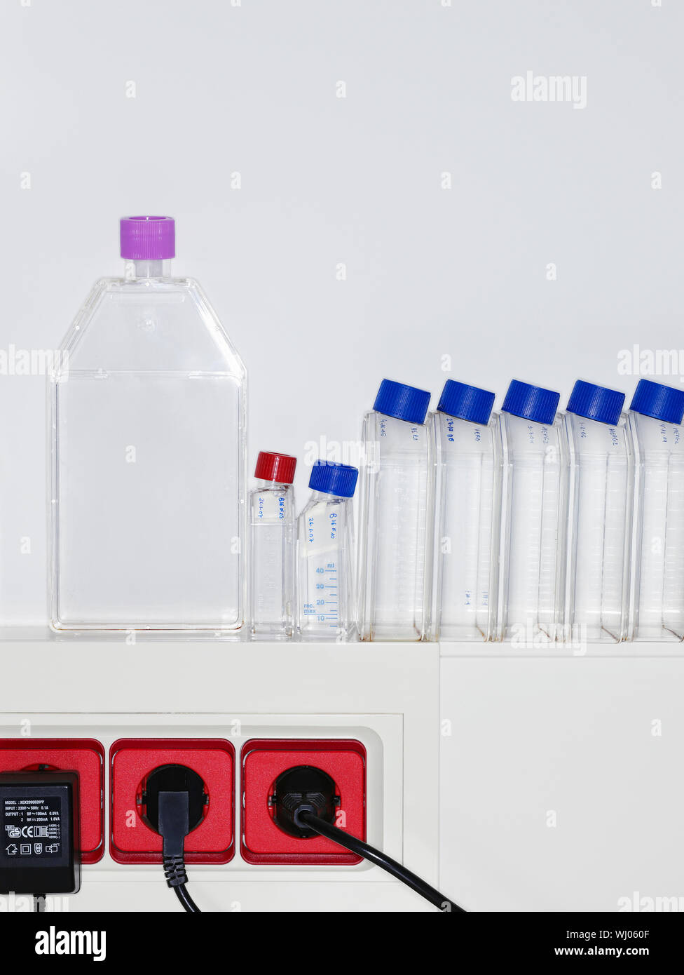 Row of specimen bottles on ledge of laboratory Stock Photo Alamy