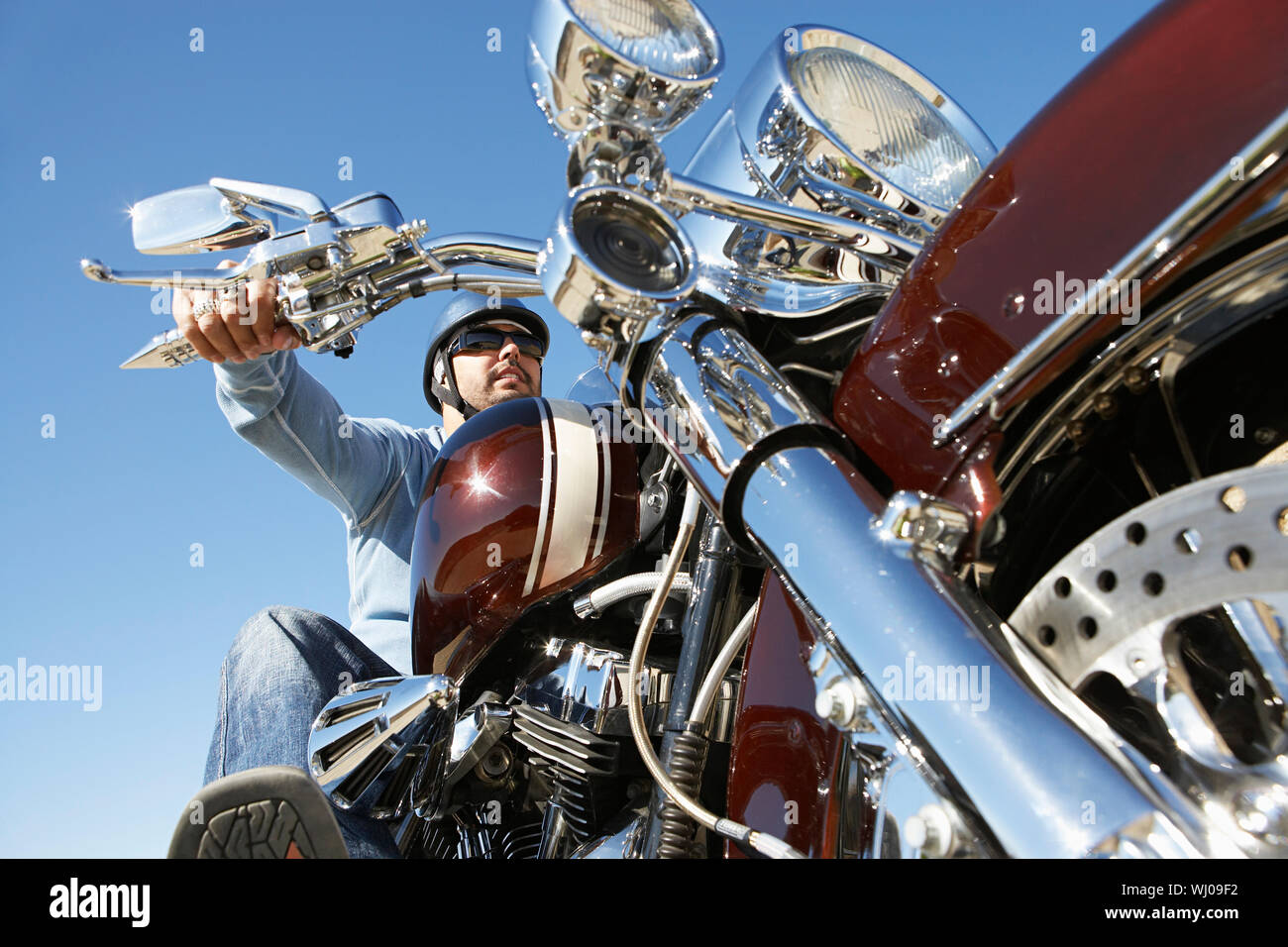 Biker riding motorcycle low angle hires stock photography and images