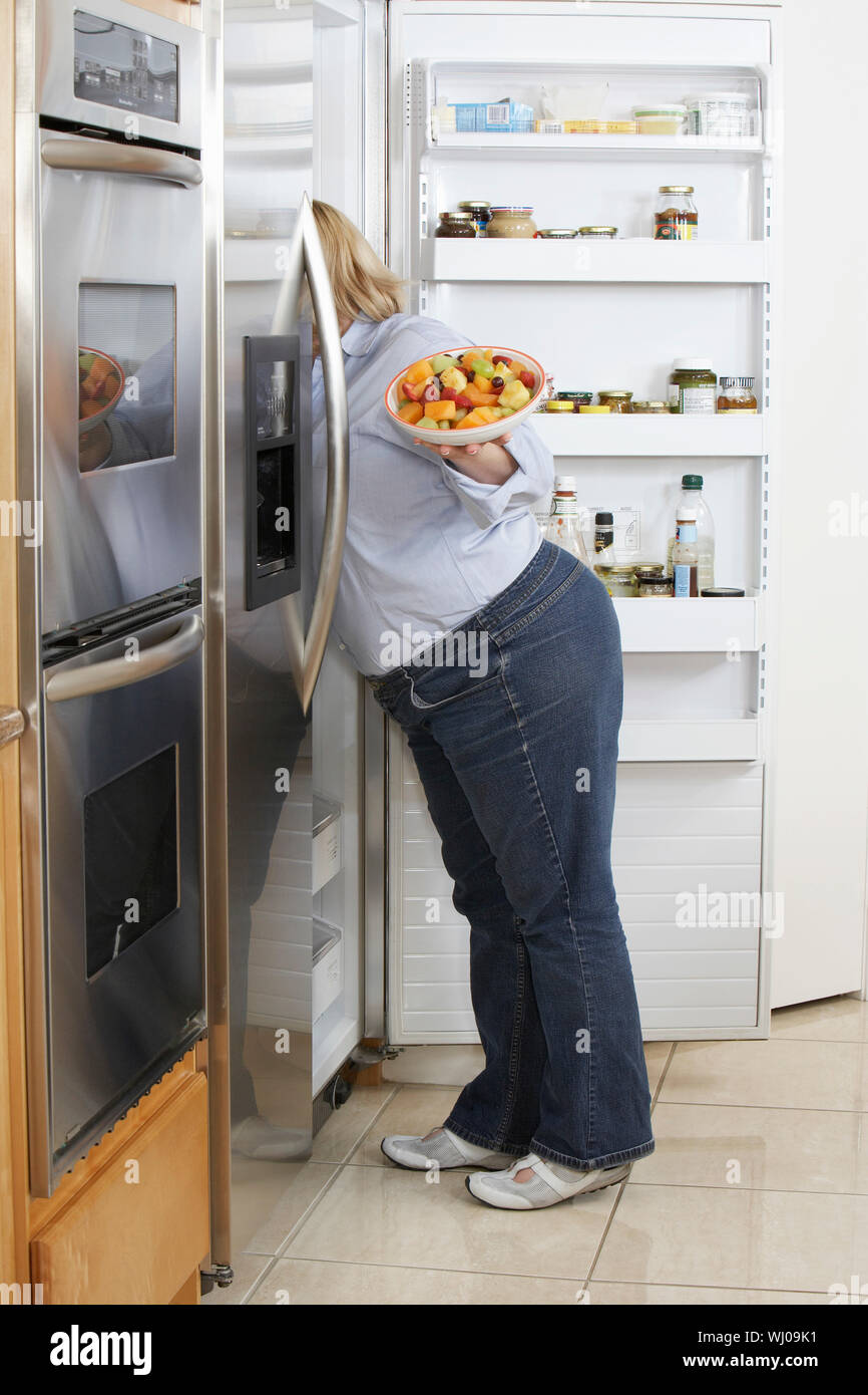 Woman Opening Lock On Fridge With Big Key Stock Photo - Download Image Now  - Chain - Object, Refrigerator, Adult - iStock