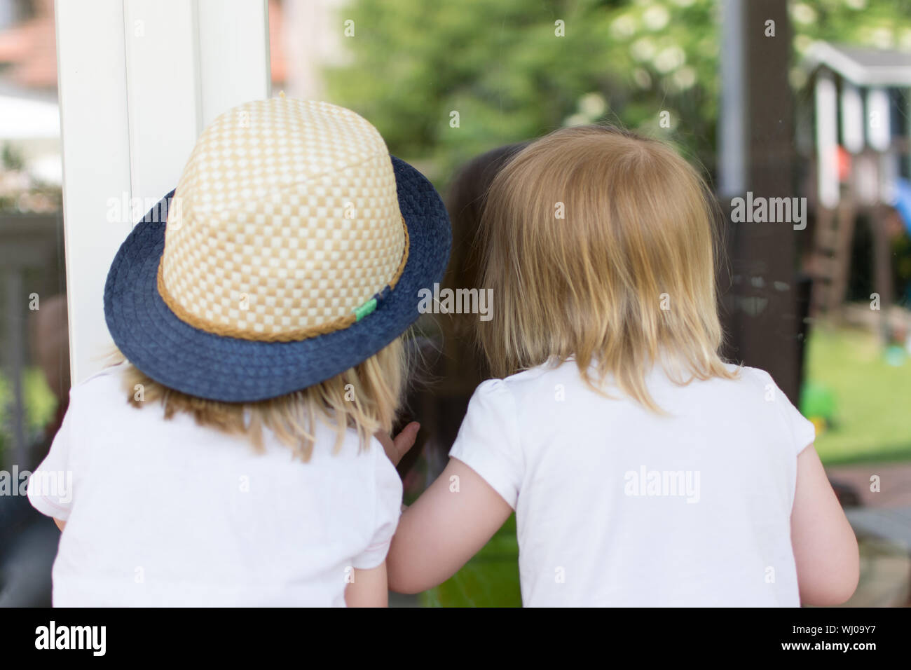 Two girls park rear view hi-res stock photography and images - Alamy
