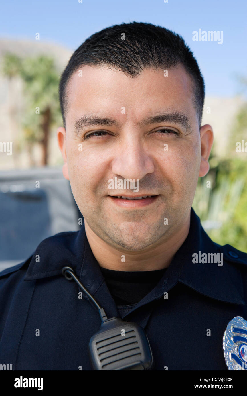 Smiling male police officer hi-res stock photography and images - Alamy