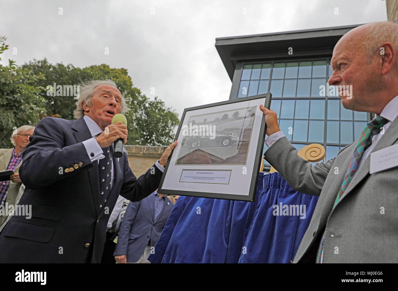 Sir Jackie Stewart being presented with a gift from  the Trust. Jim Clark  Motorsport museum 29th August 2019 Stock Photo