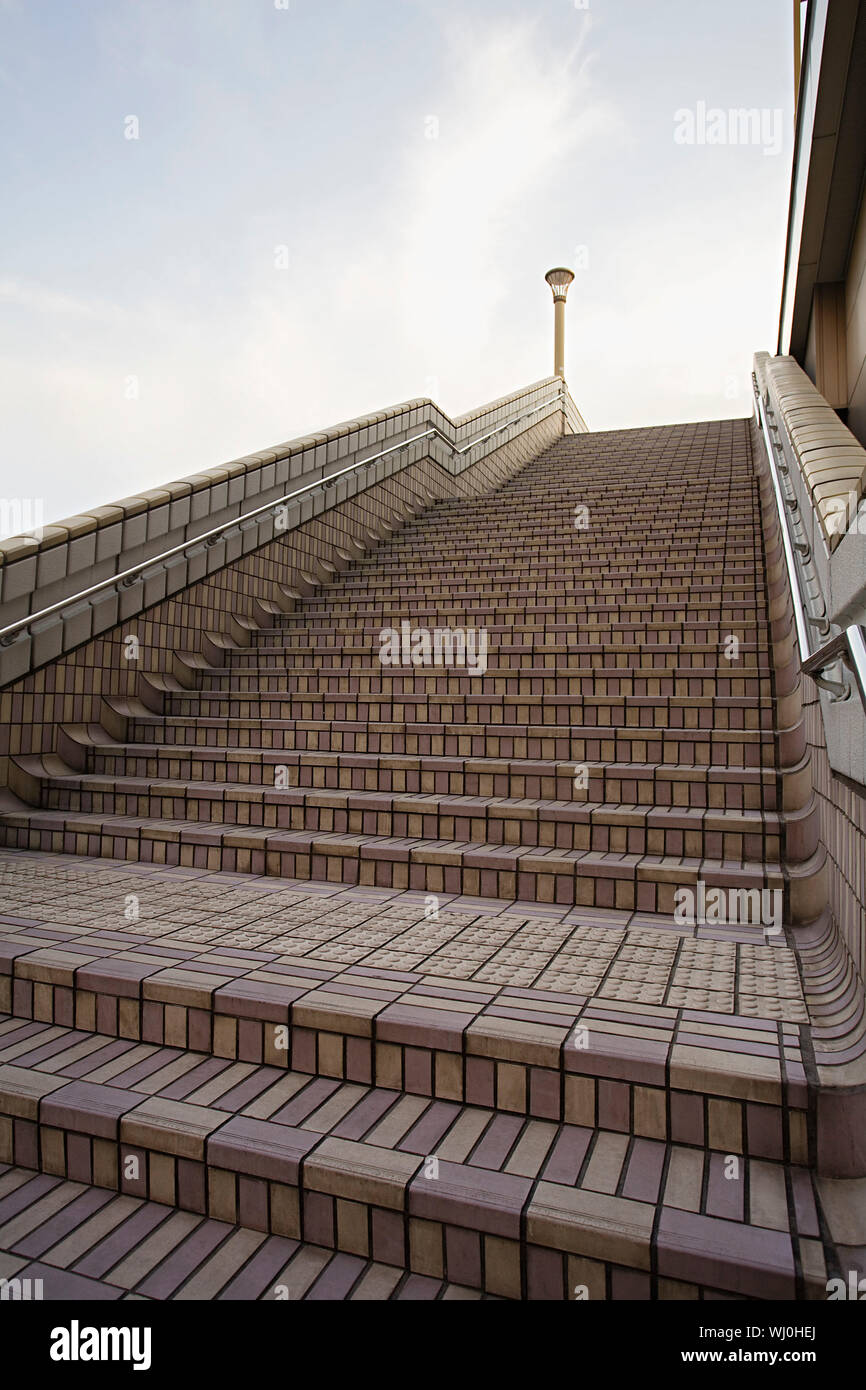 Japan, Tokyo, Ueno JR Station, man on top of steps Stock Photo