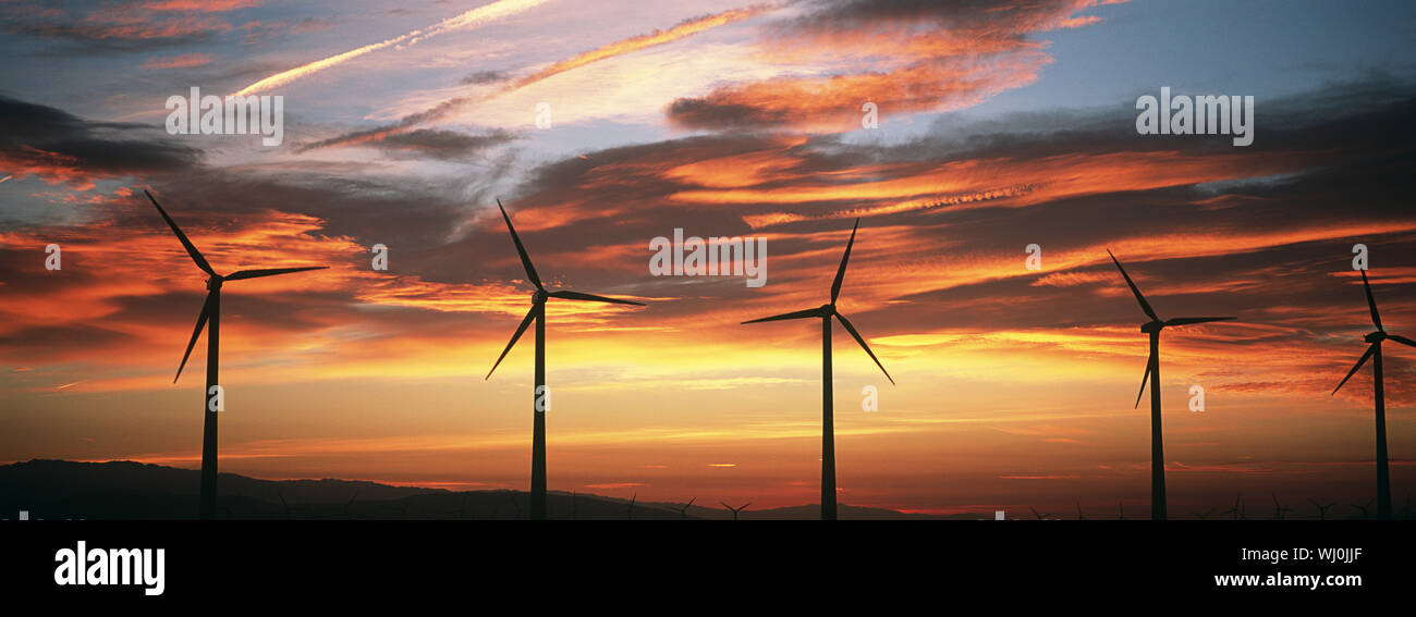 Silhouettes of wind turbines at sunset Stock Photo - Alamy